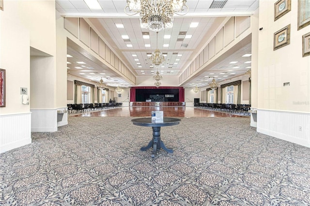 6758 SW 114th Street Rd, Ocala, FL 34476 - lobby featuring a wainscoted wall, a decorative wall, and a drop ceiling