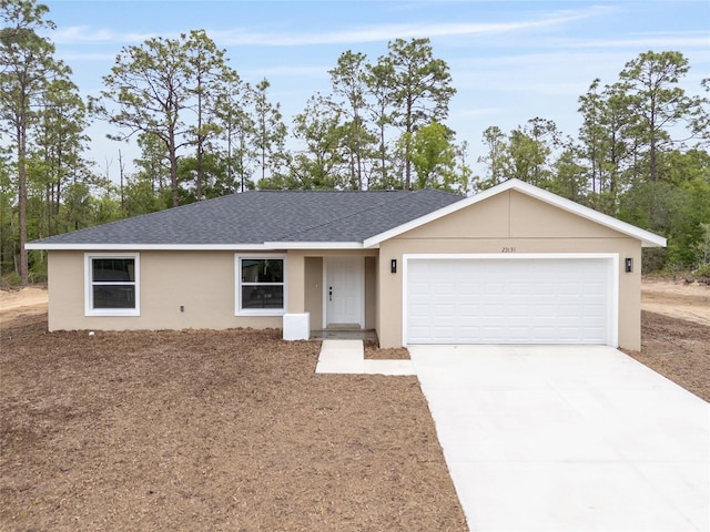 23131 SW Rainelle Rd, Dunnellon, FL 34431 - ranch-style home with a shingled roof, driveway, an attached garage, and stucco siding