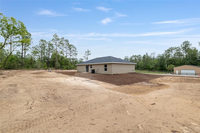 23131 SW Rainelle Rd, Dunnellon, FL 34431 - back of property with fence and a detached garage