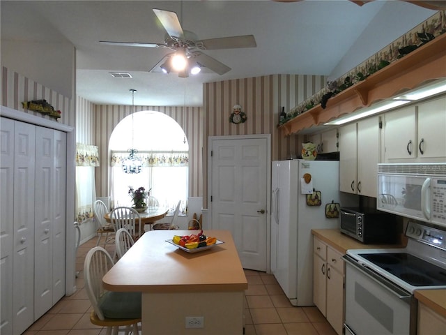 kitchen with wallpapered walls, visible vents, a ceiling fan, and white appliances