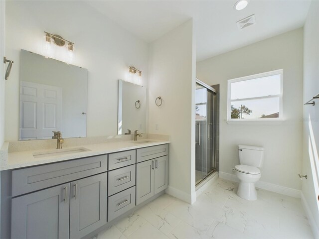 bathroom with toilet, a stall shower, a sink, visible vents, and marble finish floor