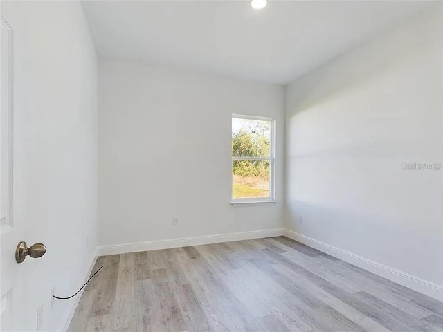 4415 SW 169th Lane Rd, Ocala, FL 34473 - empty room featuring light wood-type flooring and baseboards