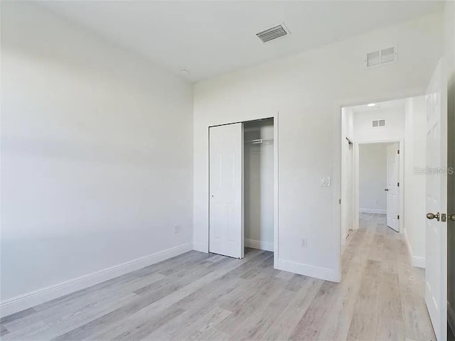 4415 SW 169th Lane Rd, Ocala, FL 34473 - unfurnished bedroom featuring light wood-type flooring, baseboards, and visible vents