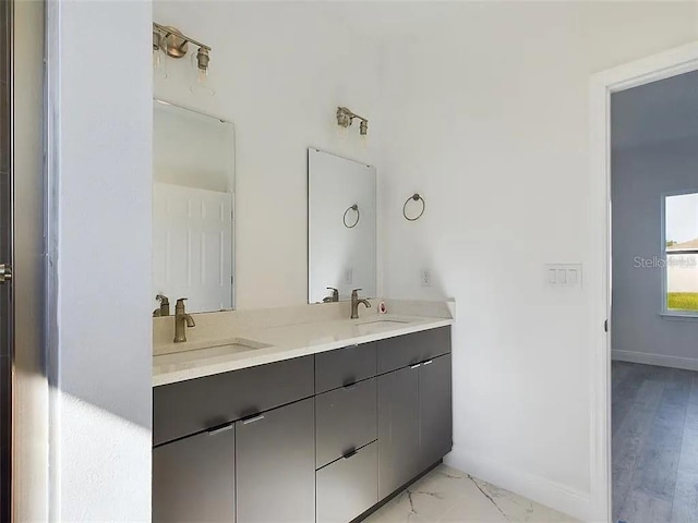 4415 SW 169th Lane Rd, Ocala, FL 34473 - full bathroom with a sink, double vanity, and marble finish floor