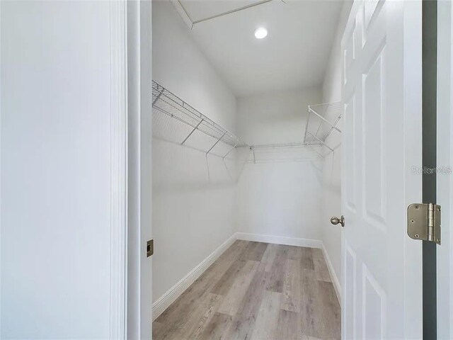 4415 SW 169th Lane Rd, Ocala, FL 34473 - spacious closet featuring light wood-style floors