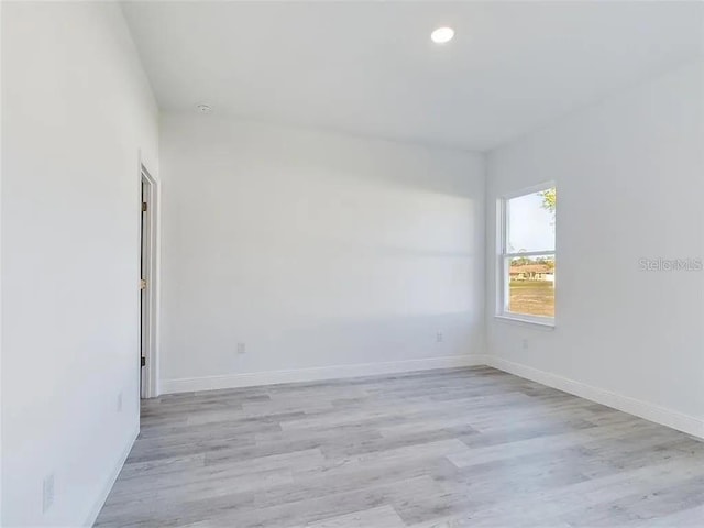 4415 SW 169th Lane Rd, Ocala, FL 34473 - empty room featuring baseboards, light wood-type flooring, and recessed lighting