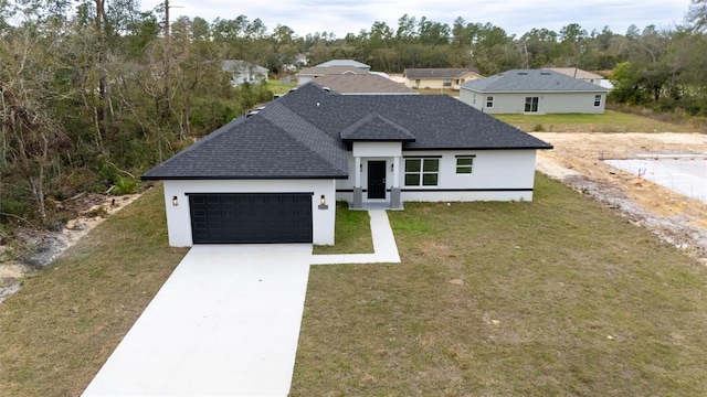 16890 SW 39th Cir, Ocala, FL 34473 - view of front of house featuring a garage, stucco siding, a shingled roof, concrete driveway, and a front lawn