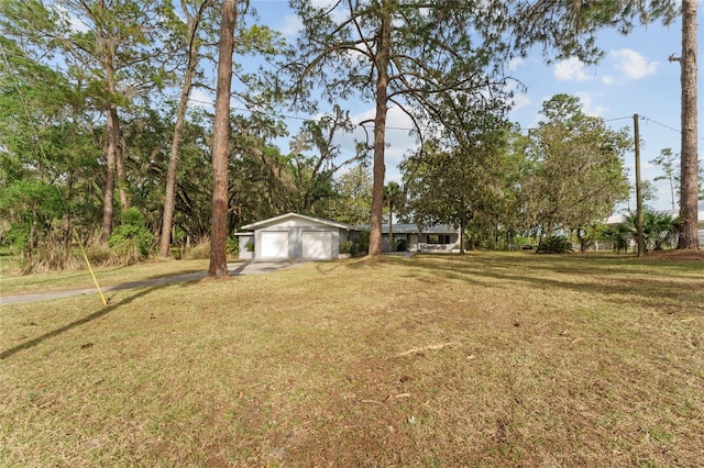 view of yard with a garage