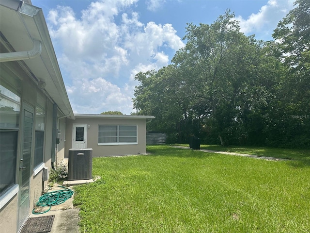 79 S Harrison St, Beverly Hills, FL 34465 - view of grassy yard featuring central air condition unit
