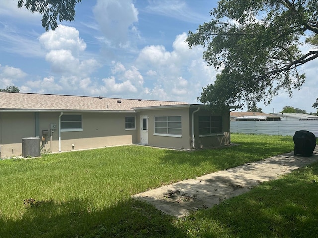 79 S Harrison St, Beverly Hills, FL 34465 - back of house featuring central air condition unit and stucco siding