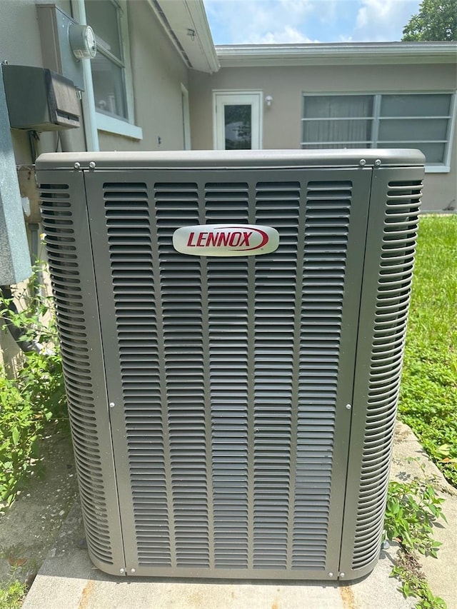 79 S Harrison St, Beverly Hills, FL 34465 - exterior view of central AC unit and stucco siding