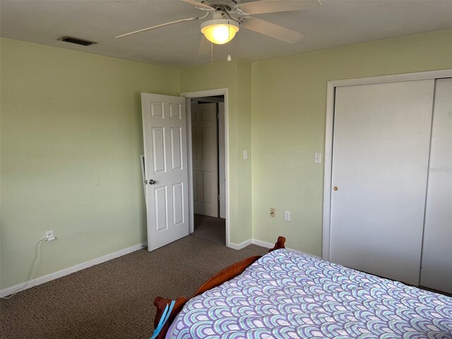 79 S Harrison St, Beverly Hills, FL 34465 - bedroom featuring dark colored carpet, baseboards, a closet, and a ceiling fan