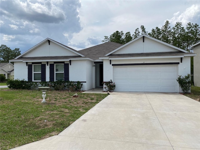 ranch-style house featuring a front yard, driveway, stucco siding, and a garage
