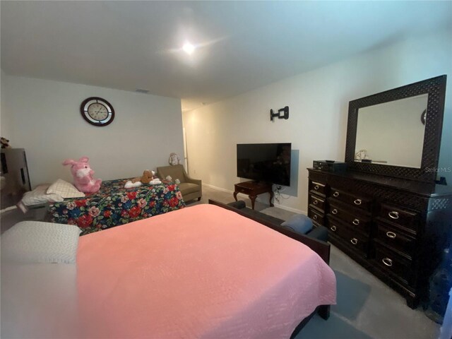 bedroom featuring carpet flooring and baseboards