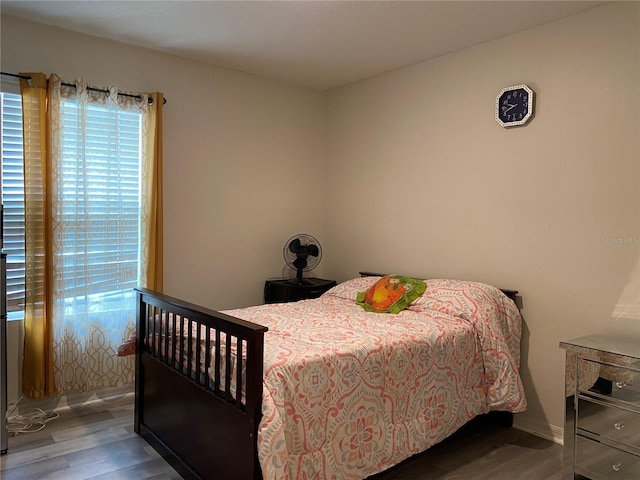 bedroom with wood finished floors