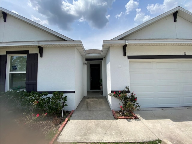 12 Hickory Course Way, Ocala, FL 34472 - entrance to property featuring stucco siding and a garage