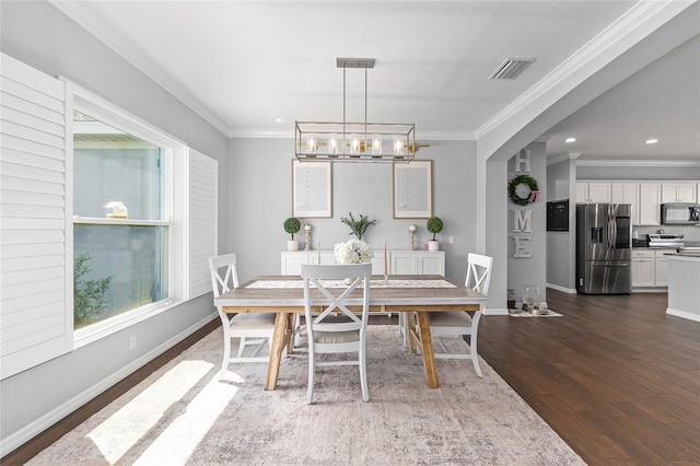 dining area with dark wood-style flooring, ornamental molding, a chandelier, baseboards, and recessed lighting