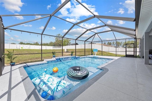 view of swimming pool featuring a patio and a lanai