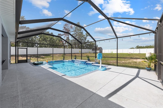 view of pool featuring a patio and glass enclosure