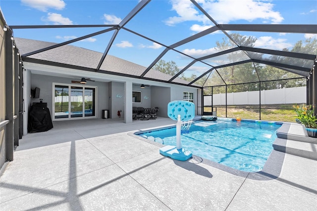 view of swimming pool featuring a ceiling fan, a patio, and a lanai
