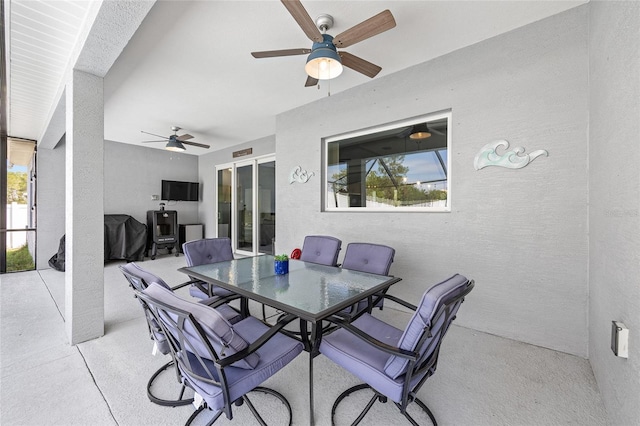 view of patio / terrace featuring a ceiling fan and outdoor dining space