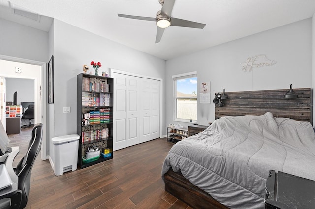 bedroom with wood finished floors, a closet, a ceiling fan, and baseboards