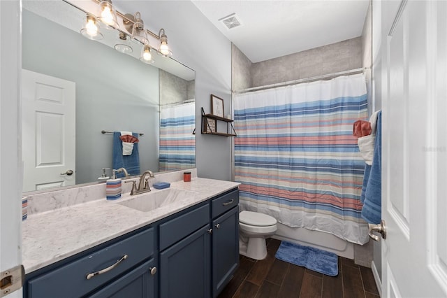 full bathroom with toilet, wood finished floors, vanity, and shower / bathtub combination with curtain