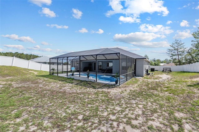 view of pool featuring glass enclosure and a patio