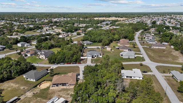 aerial view of property and surrounding area with nearby suburban area