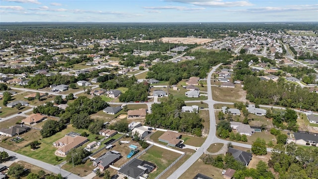 aerial overview of property's location with nearby suburban area