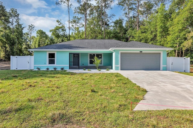 ranch-style home with an attached garage, a gate, stucco siding, a front yard, and driveway