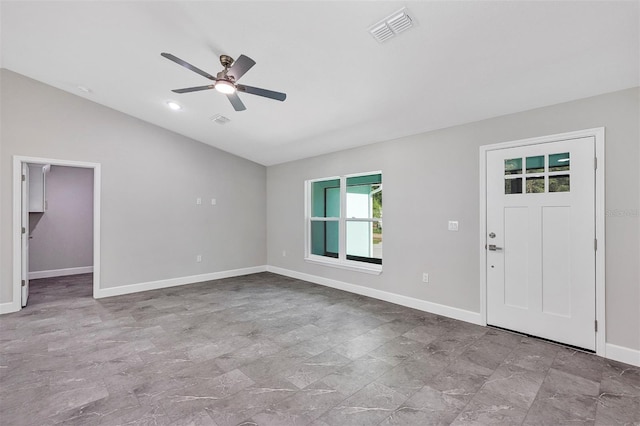 entryway featuring vaulted ceiling, ceiling fan, baseboards, and visible vents