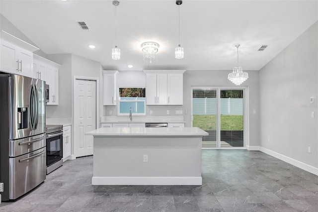 kitchen with a sink, light countertops, visible vents, and appliances with stainless steel finishes