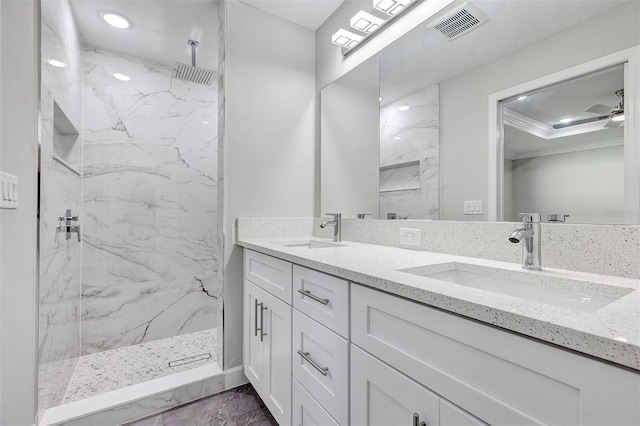 full bathroom featuring marble finish floor, ornamental molding, visible vents, and a sink