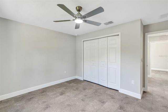 unfurnished bedroom featuring ceiling fan, baseboards, a closet, and visible vents