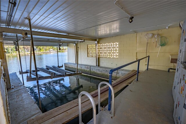 414 NW 8th Ave, Crystal River, FL 34428 - dock featuring boat lift and a water view