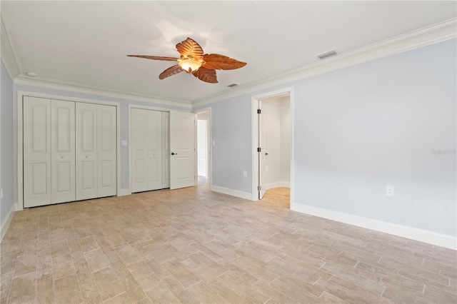 414 NW 8th Ave, Crystal River, FL 34428 - unfurnished bedroom featuring crown molding, multiple closets, light wood-style flooring, baseboards, and ceiling fan