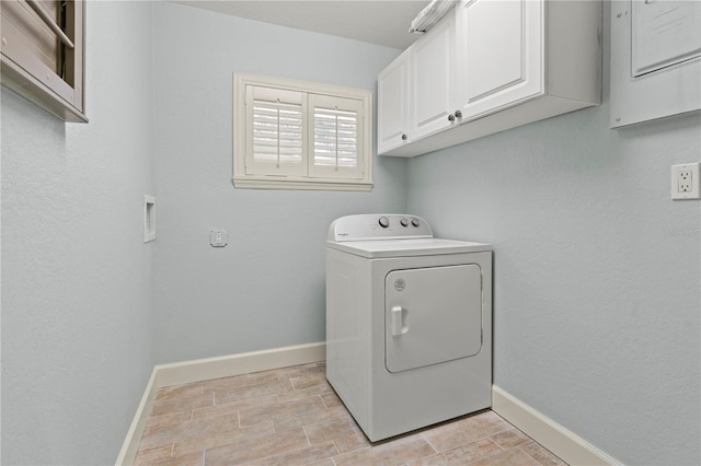 414 NW 8th Ave, Crystal River, FL 34428 - laundry room featuring washer / dryer, cabinet space, and baseboards
