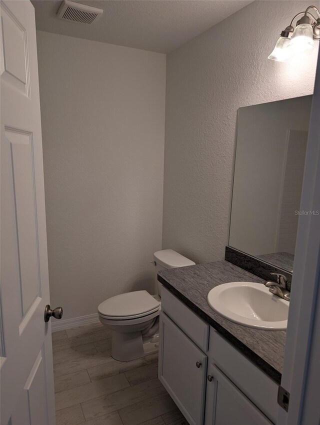 267 Oak Lane Trak, Ocala, FL 34472 - half bath with toilet, visible vents, and vanity