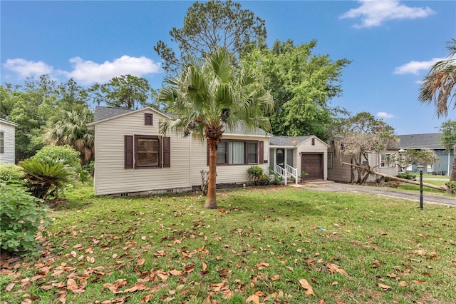 ranch-style house with a garage, driveway, a front lawn, and crawl space