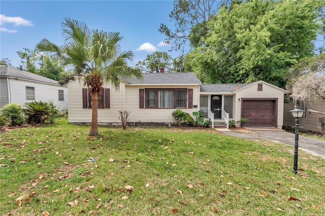 ranch-style house with a garage, driveway, a front lawn, roof with shingles, and a chimney