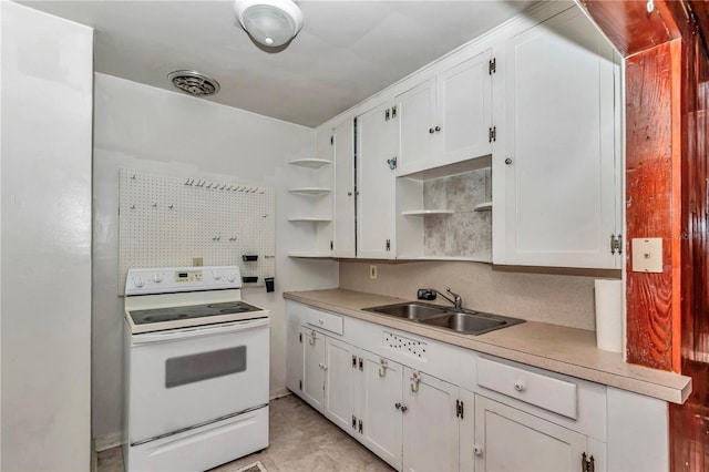 kitchen featuring electric stove, a sink, open shelves, white cabinetry, and light countertops