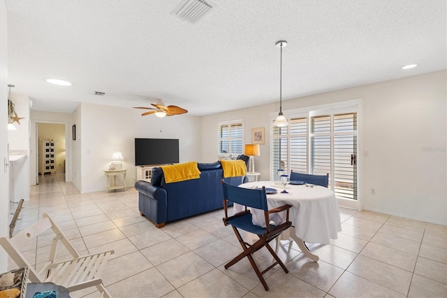 1736 Watts Mill Way, The Villages, FL 32162 - dining area featuring ceiling fan, light tile patterned flooring, baseboards, a textured ceiling, and recessed lighting
