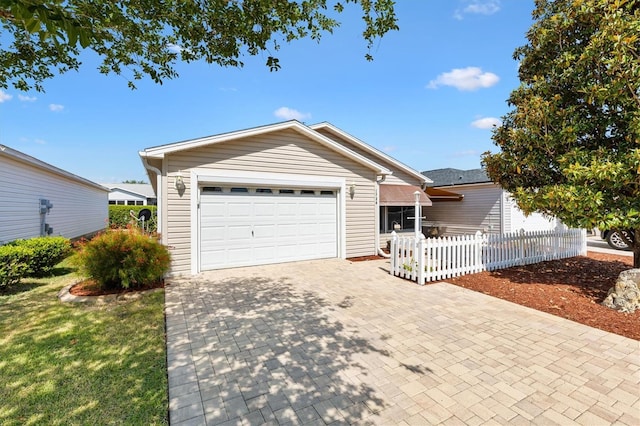 1736 Watts Mill Way, The Villages, FL 32162 - ranch-style home with fence, a garage, and decorative driveway