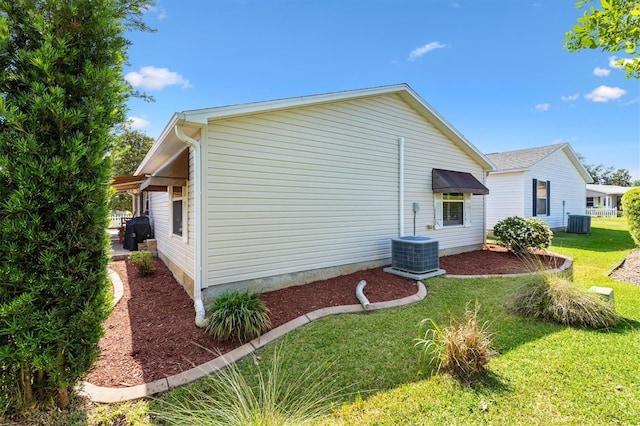 1736 Watts Mill Way, The Villages, FL 32162 - view of side of property featuring central AC unit and a yard