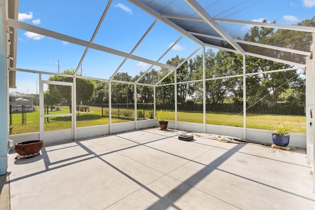 unfurnished sunroom featuring vaulted ceiling