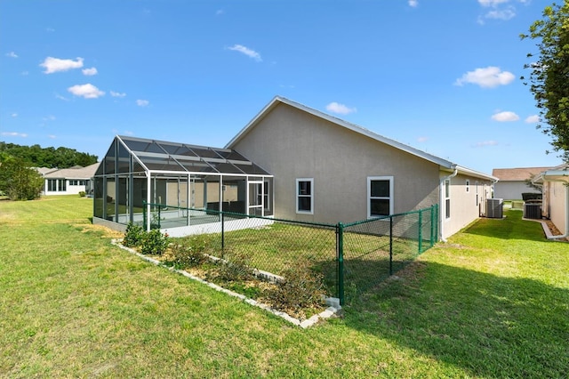 rear view of property with stucco siding, central air condition unit, a lanai, and a swimming pool