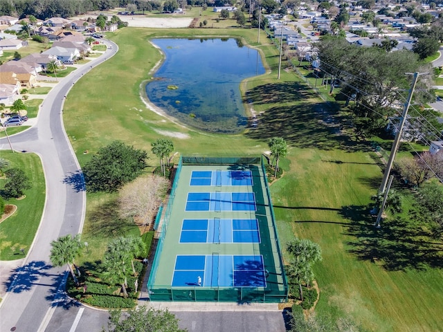 aerial perspective of suburban area featuring a nearby body of water
