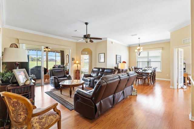 living area featuring a ceiling fan, light wood-style floors, ornamental molding, a chandelier, and baseboards