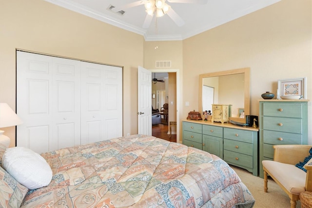 bedroom featuring a closet, ornamental molding, and ceiling fan